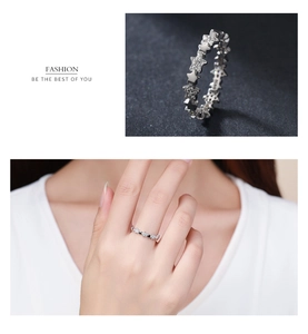 Detailed view of S925 sterling silver star ring with crystals and model on-hand display