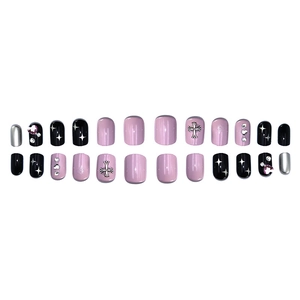 Pink and black short press-on nails with silver metal cross and heart rhinestone accents