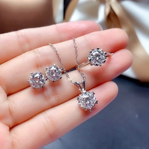 Close-up of sparkling jewelry set with round brilliant cut stones and snowflake prongs