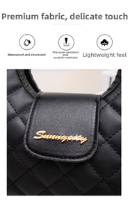 Macro shot of waterproof quilted black PU leather bag showing logo and gold hardware
