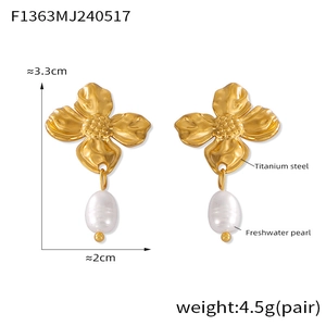 Detail view of gold flower earrings with freshwater pearl drop and size measurements