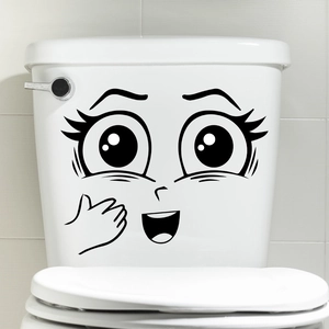 Funny cartoon face emoji vinyl sticker applied on a white ceramic toilet tank cover