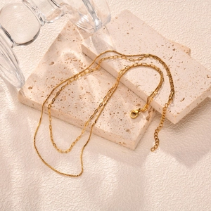 Gold double-layered stainless steel necklace featuring a snake chain and rectangular links
