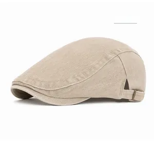 Detail view of khaki flat cap with side metal buckle and clean stitching on cotton twill