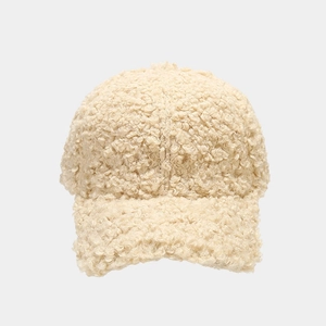 Detailed close-up showing the soft texture of the beige faux fur winter baseball cap