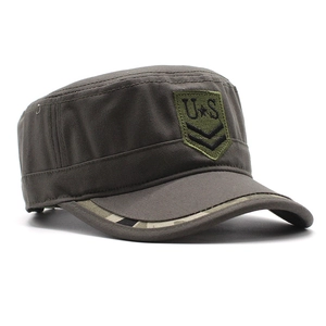 Detail of dark grey cadet cap featuring olive green US embroidery and camo brim edge