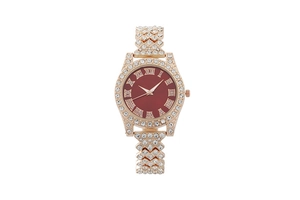 Detail of rose gold luxury watch with sparkling crystals and deep red Roman numeral dial