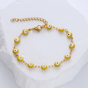 Golden stainless steel evil eye bracelet with yellow beads and adjustable lobster clasp