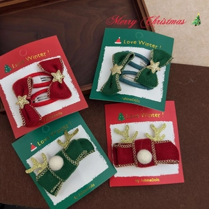 Festive Christmas felt hair clips with reindeer antlers and bows on display card