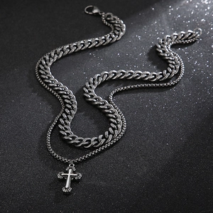 Close-up of double-layer stainless steel cross pendant necklace with Cuban chain