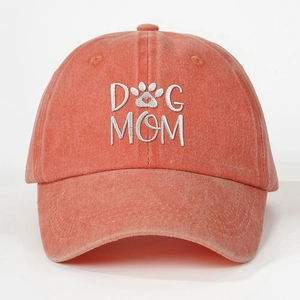 Vintage washed coral baseball cap with white DOG MOM embroidery and paw print design