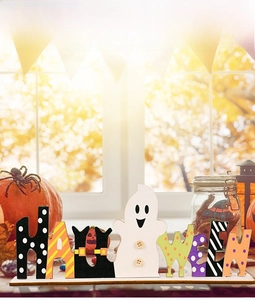 Close-up of wood Halloween table sign with creative ghost letter and vibrant patterns