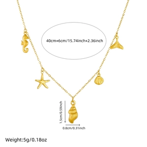 Gold plated ocean theme necklace with starfish and seashell pendants on white background