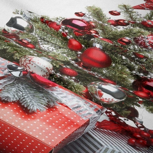 Close-up of Christmas tapestry fabric showing festive pine, red ornaments and bells