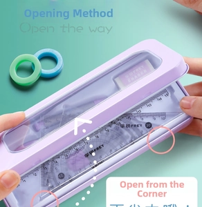 Detail showing the easy open mechanism of a purple metal pencil case with student stationery set