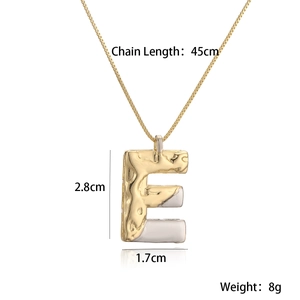 Detail view of two-tone gold and silver letter E pendant necklace with dimensions