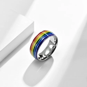 Titanium steel ring with rainbow enamel stripes on a minimalist white background