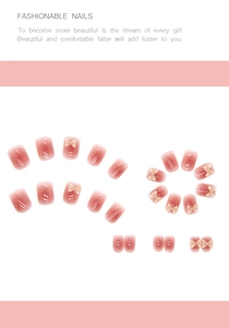 Detail of rose pink translucent press-on nails with 3D crystal bow decorations