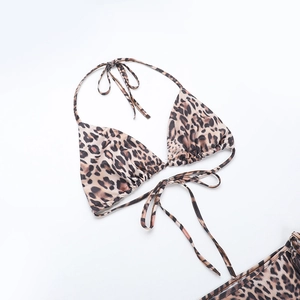 Detailed flat lay of leopard print triangle bikini top with adjustable neck ties