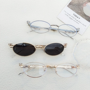 Retro oval metal sunglasses with rhinestone embellishments in gold silver and black