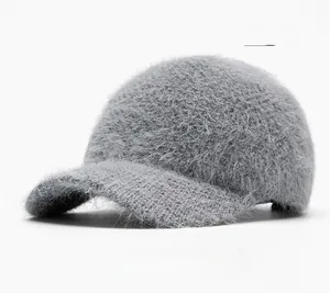 Detail view of the thick gray faux fur texture and curved brim of the winter baseball cap