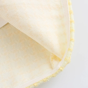 Women's chic pale yellow tweed jacket with premium textured fabric and classic round neck