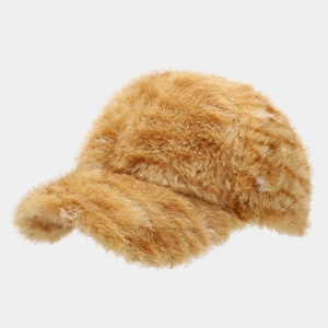 Detailed close-up of brown faux fur texture on a warm plush winter baseball cap