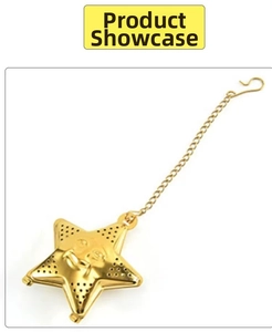 Macro view of gold star-shaped stainless steel tea infuser with hanging chain and holes