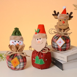 Three-piece Christmas burlap gift bags set featuring Santa, snowman, and reindeer motifs