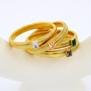Set of four gold-plated snake-style Tubogas bracelets with rectangular zircon stones