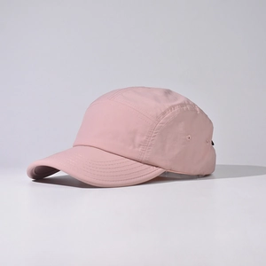 Detail of pink camper cap showing quick-dry fabric texture and fine stitching