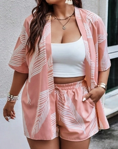 Detail of pink palm print oversized cardigan and drawstring shorts set with airy fabric