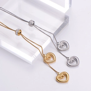 Macro shot of 3D hollow heart pendant with spiral texture and crystal sliding bead