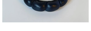 Detailed macro shot of a black PU leather padded headband with unique quilted segments