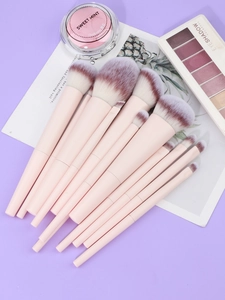 Detail view of 12-piece pink makeup brush set with gradient synthetic fiber bristles