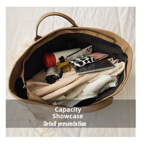 Top view of large brown tote bag showing ample space for water bottle, umbrella and clothes
