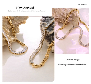 Macro detail of geometric gold link chain and pave set rectangular white zircon stones