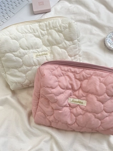 Quilted heart pattern cosmetic bags set in off-white and pink with zipper closure