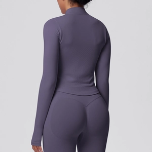 Macro detail of the fine ribbed fabric on the back of this mauve athletic yoga set