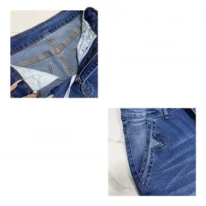 Détails d'un jean bleu avec fermeture éclair et broderie d'étoile sur la poche