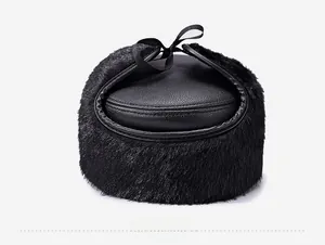 Rear detail of winter flat cap showing faux fur lining and black leather crown texture