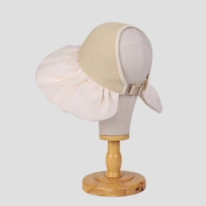 Adjustable beige straw open top sun hat with large brim shown on a mannequin head