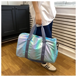 Detail of laser reflective travel bag in blue-purple gradient with sturdy blue straps