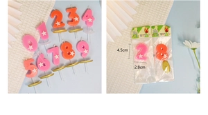 Dettagli candele di compleanno a forma di numero rosa e arancio con stelle e dimensioni