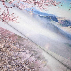 Detailed macro view of woven fabric texture and mountain scenery print on tapestry