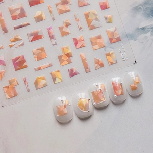 Detail of shell shimmer nail stickers with artistic orange oil painting blocks and glossy finish
