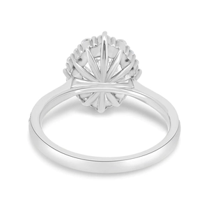 Macro shot of princess-cut zircon engagement ring with intricate silver floral metalwork