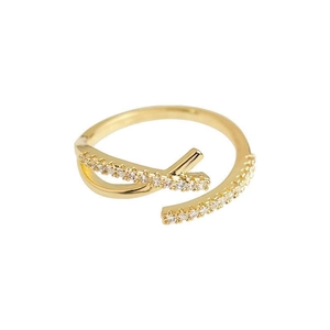 Elegant gold crossover ring with zircon stones in a minimalist French style design