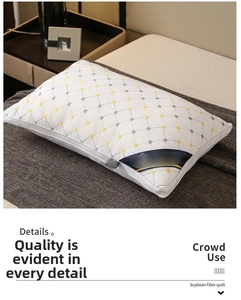 Detail view of white soybean fiber pillow featuring quilted diamond lattice and contrast stitching