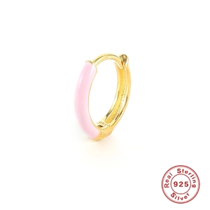 Detailed view of S925 sterling silver stamp on golden hoop earring with pink enamel